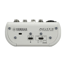 Load image into Gallery viewer, Yamaha AG03 Live Streaming Mixer device shown from the rear, featuring silver metal input/output jacks, USB 2.0 port, 5V DC port, and mounting screws on a white casing.