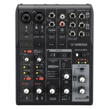 Load image into Gallery viewer, Yamaha AG606 multi-channel audio mixer console with black front panel, white control knobs, red and yellow indicator lights, and silver jacks on a white background.